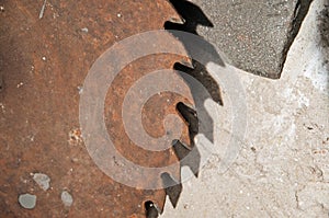 Old rusty circular saw and emery wheel