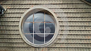 Old and rusty circular skylight in a roof