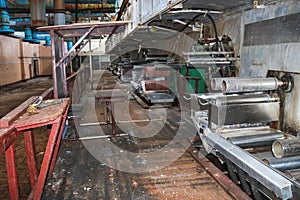 Old rusty closed peeling shop at a abandoned industrial obsolete chemical petrochemical engineering refinery with metal iron pipes