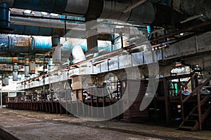 Old rusty closed peeling shop at a abandoned industrial obsolete chemical petrochemical engineering refinery with metal iron pipes