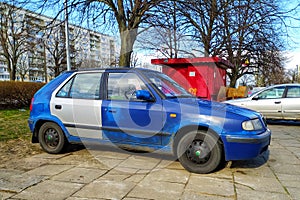 Old blue rusty scrap car Skoda Felicia parked