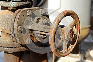 An old rusty dirty control valve on the pipe