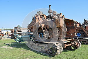 Old rusty disassembled combine harvester.