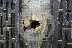 Old Rusty door with the broken glass