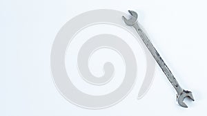 Old rusty double spanner or wrench key tool isolated on white background