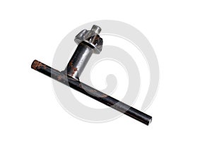 old rusty drill key on a white background