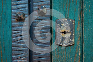 Old rusty and dusty keyhole wallpaper. Vintage keyhole on old wooden door background. Keyhole of old door.