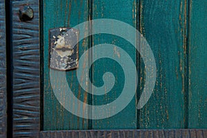 Old rusty and dusty keyhole wallpaper. Vintage keyhole on old wooden door background. Keyhole of old door.