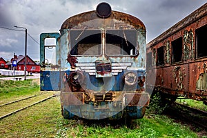 Old rusty electric train abandoned on unused siding