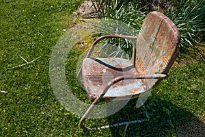 Old and rusty empty chair, death loss and grief metaphor