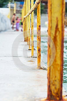 Old rusty fence by the sea in Marine Trade Port