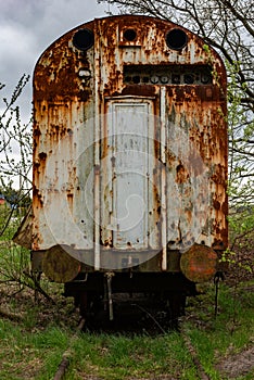 Old rusty freight carriage wagon on railway siding