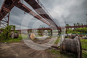 Old rusty gantry bridge crane in abandoned factory