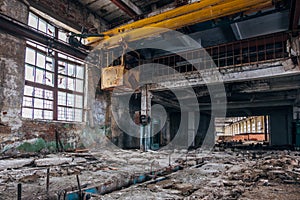 Old rusty gantry crane in abandoned factory