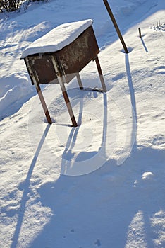 Old rusty grill on a sunny winter day