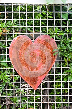 Old Rusty Heart On Wooden Background