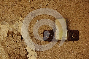 Rusty hook On the old cement wall
