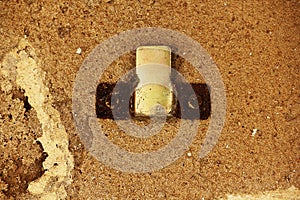 Rusty hook On the old cement wall