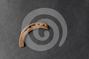 Old rusty horse shoe on black colored background. It is used for to protect a horse hoof from wear