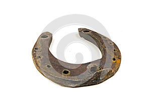 Old rusty horseshoe on a white background