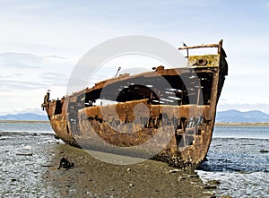 Old rusty hulk of Jannie Seddon on the beach