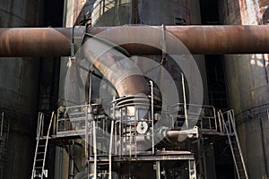 Old rusty industrial mechanism of pipeline