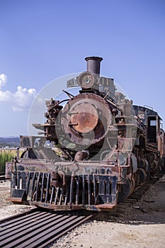 Old rusty iron parts of an antique steam engine