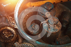 Old rusty iron weights and a wooden flute in a metal plate