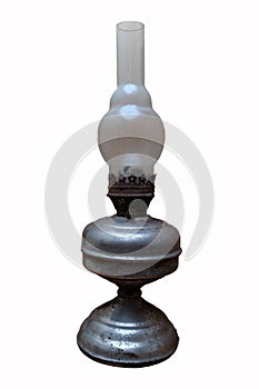 The old rusty kerosene lamp on a white background