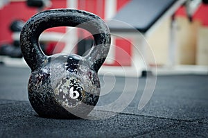 Old and rusty Kettle Bell on the gym floor