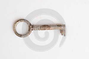 Old rusty key isolated on white background -