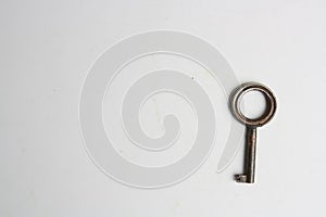 Old rusty key isolated on a white background