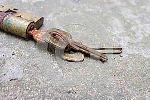 Old rusty keys in lock. Vintage door padlock with keys. Antique keys on weathered background with copy space. Security and safety.