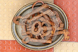 Old rusty keys on a plate. Antiques