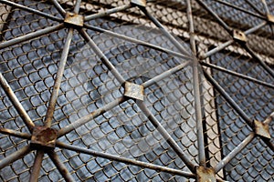 Old rusty lattice on a window background