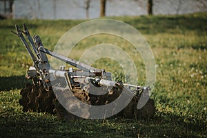 Old rusty lawnmower  in a field