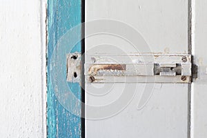 Old rusty lock bolt broken and door old wooden door with copyspace.