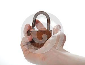Old rusty lock in male hand