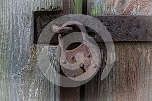 Old rusty lock on old wood with fantastic key hold, a real antique piece of history