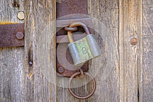 Old rusty lock on wooden door 2