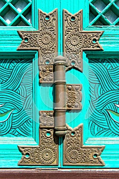 Old rusty lock on the wooden gate.