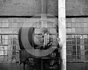 Old rusty machinery outside abandoned factory