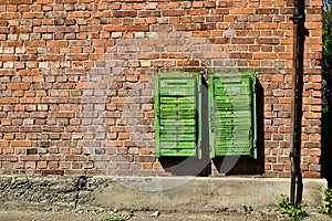 Old rusty mail boxes on brick wall