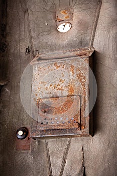 Old rusty mailbox on the front door