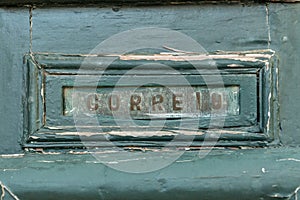 Old rusty mailbox with the word correio photo