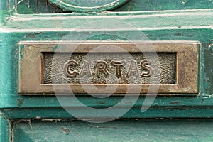 Old rusty mailbox with the word photo