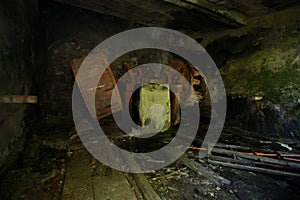 Old rusty mechanical gears inside a building in the abandoned mines of Calferro in the Mulina di Stazzema photo