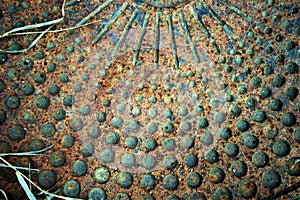 Old rusty metal background with perforated circles