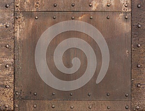 Old rusty metal background with rivets