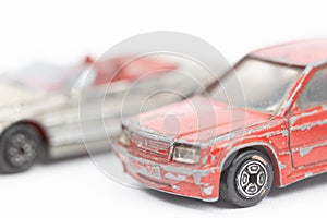 Old and rusty metal car toys isolated above white background